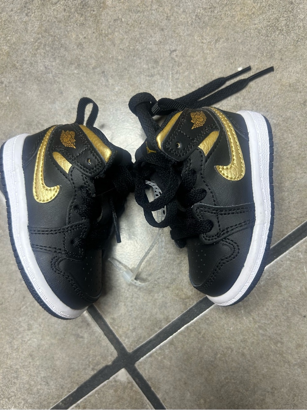 Jordan Kids Black and Gold Sneakers